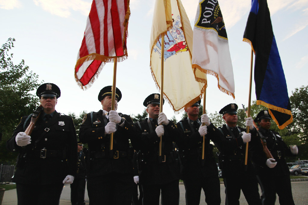 Honor Guard lining up to pose with flags. 